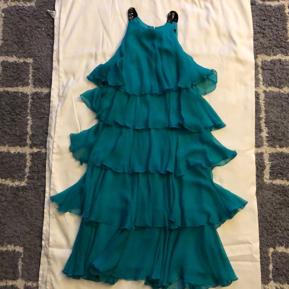 BCBCMAXAZRIA Blue-green sleeveless ruffle dress.